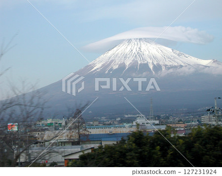 Mount Fuji's cap clouds and hanging clouds seen from the Shinkansen train window Mount Fuji's cap clouds and hanging clouds seen from the Shinkansen train window 127231924