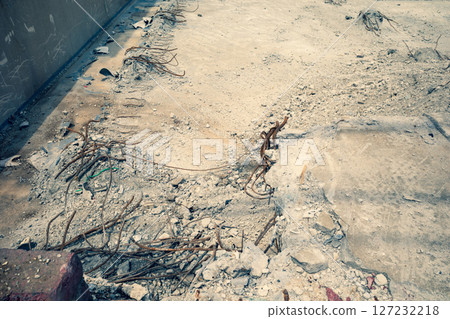 Demolition of a house: Concrete and rebar in the basement a-3 Emphasis on warm and cool colors Demolition of a house: Concrete and rebar in the basement a-3 Emphasis on warm and cool colors 127232218