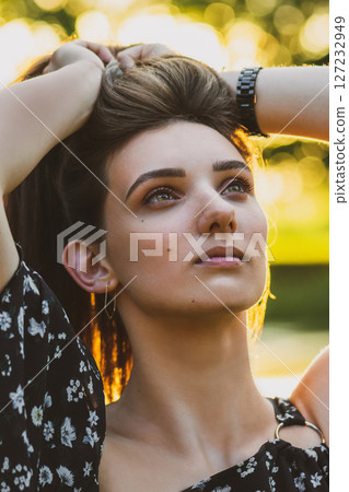 Woman portrait during summer sunset in nature 127232949