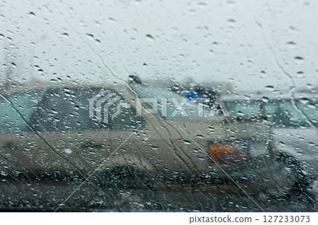 trafic jam in the rainny day, view via front window of car 127233073