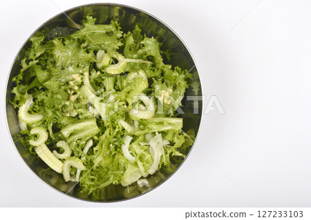 Green salad in a metal bowl 127233103