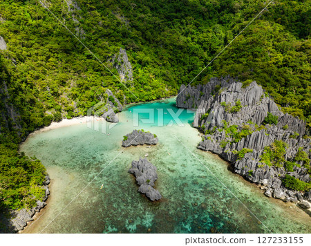 Cadlao Lagoon with transparent turquoise sea water with corals in El Nido, Philippines. Cadlao Lagoon with transparent turquoise sea water with corals in El Nido, Philippines. 127233155