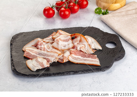 Raw pork tenferloin with bacon Raw pork tenferloin with bacon 127233333