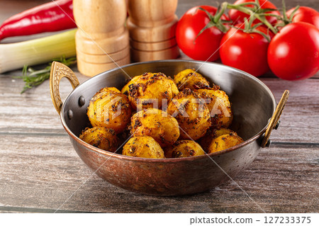 Baked small baby potato with herbs Baked small baby potato with herbs 127233375
