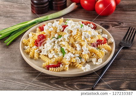 Italian pasta fusili with curd 127233387