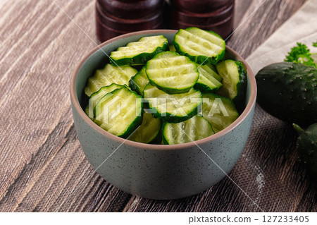 Fresh green ripe cucumber slices 127233405
