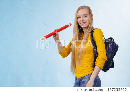 Young woman going to school Young woman going to school 127233812
