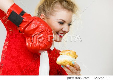 Woman boxing cream cupcake 127233902