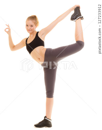 Fitness sporty girl showing ok okay hand sign gesture Fitness sporty girl showing ok okay hand sign gesture 127233912
