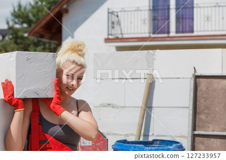 Woman working with airbricks Woman working with airbricks 127233957
