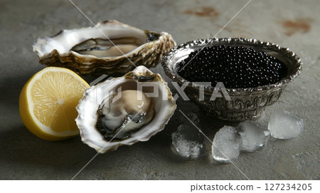 Fresh Oysters and Black Caviar on Ice with Lemon Slice 127234205