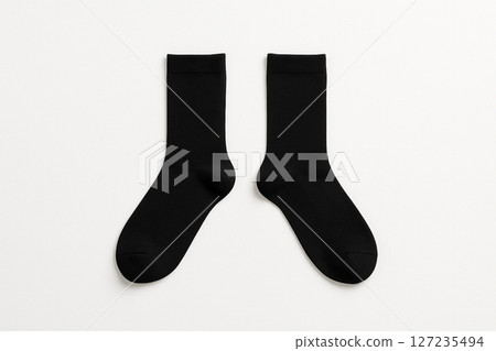 A simple black sock on a white background 127235494