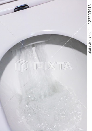 Maintain a clean toilet by using fresh water consistently and flushing it regularly 127235618