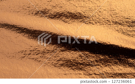 Copper metal surface with vintage, rustic texture. Warm, brown tones with a luxurious, antique feel. 127236061