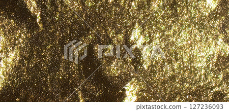 A luxurious golden glitter background with a shiny, sparkling effect. The shimmering texture of A luxurious golden glitter background with a shiny, sparkling effect. The shimmering texture of 127236093