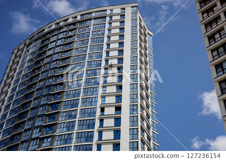 man window cleaner washes the facade man window cleaner washes the facade 127236154