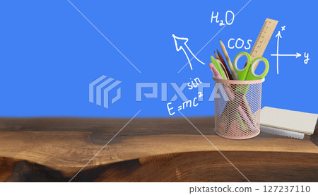 School and office supplies, pens, pencils, ruler, compass in a metal cup on a white background. Back to school 127237110