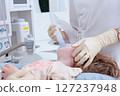 Child is under anesthesia. Small child is undergoing surgery. Concept of medical care. 127237948