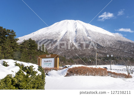 Snowshoe trekking image with Mt. Oyama in the background 127238211