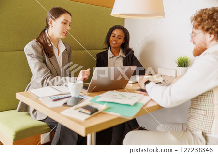 Engaging in a Collaborative Meeting within a Modern Workspace Environment for Team Success Engaging in a Collaborative Meeting within a Modern Workspace Environment for Team Success 127238346