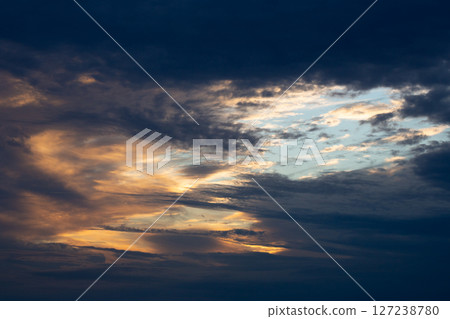 Beautiful dark colorful dramatic sky with clouds at sunset or sunrise. Beautiful dark colorful dramatic sky with clouds at sunset or sunrise. 127238780
