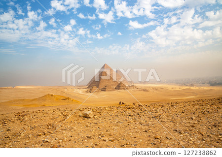 Egypt. Cairo - Giza. General view of pyramids from the Giza Plateau (three pyramids known as Queens' Pyramids on front side; next in order from left: the Pyramid of Menkaure, Khafre and Chufu 127238862