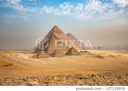 Egypt. Cairo - Giza. General view of pyramids from the Giza Plateau (three pyramids known as Queens' Pyramids on front side; next in order from left: the Pyramid of Menkaure, Khafre and Chufu 127238916