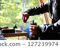 Relaxing time grinding coffee beans 127239974