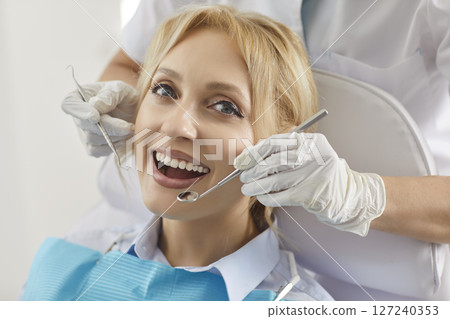 Portrait Of Happy Patient At Dentist Appointment 127240353