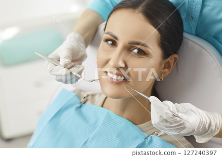 Dentist Examining Patient Teeth In Hospital Dentist Examining Patient Teeth In Hospital 127240397
