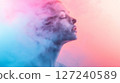 Locked on a cloud of smoke, with a pink and blue pastel-colored background, a minimal concept studio photograph. 127240589