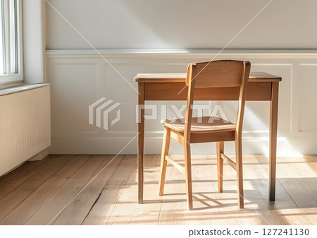 single wooden chair and school desk in clean bright space, academic theme 127241130