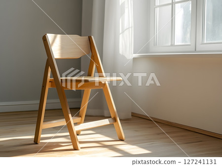 single wooden chair and school desk in clean bright space, academic theme 127241131