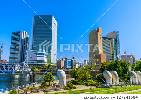 Tokyo cityscape in Japan, in front of Sakuragicho Station. View of Yokohama City Hall and Yokohama Air Cabin. Tokyo cityscape in Japan, in front of Sakuragicho Station. View of Yokohama City Hall and Yokohama Air Cabin. 127241584