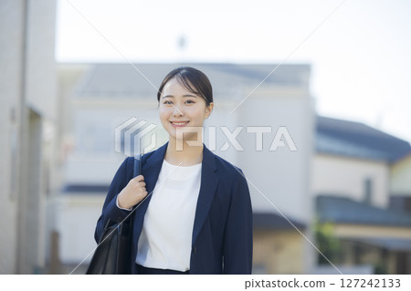 Young woman in a suit 127242133