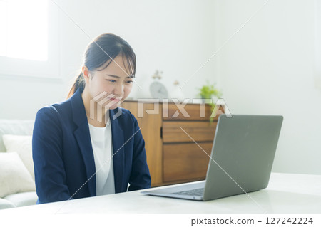 Young woman in a suit Young woman in a suit 127242224