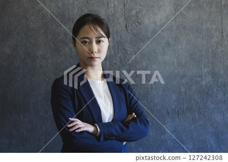 Young woman in a suit Young woman in a suit 127242308