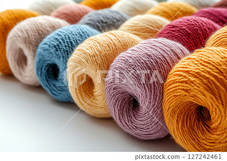 Handmade Love. Colorful yarns for knitting on a white background. Copy space. Handmade Love. Colorful yarns for knitting on a white background. Copy space. 127242461
