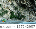 Wild Camping Beneath a Steep Rocky Cliff Face 127242957