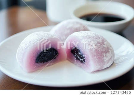Delicious Japanese moti desserts. Close up. Asian rice daifuku dessert sweet mochi. Cut in half with filling. Traditional dessert mochi ice cream. Colorful rice cake. Fukashi manju. Culinary delights Delicious Japanese moti desserts. Close up. Asian rice daifuku dessert sweet mochi. Cut in half with filling. Traditional dessert mochi ice cream. Colorful rice cake. Fukashi manju. Culinary delights 127243450