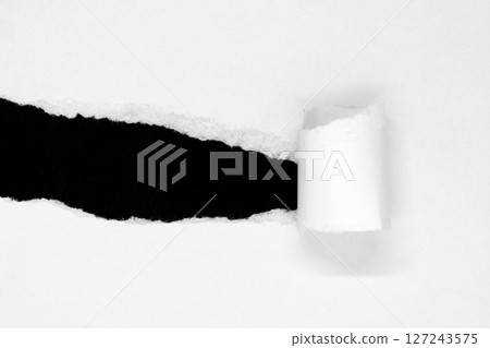 White ripped paper isolated on black background 127243575