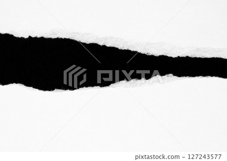White ripped paper isolated on black background White ripped paper isolated on black background 127243577