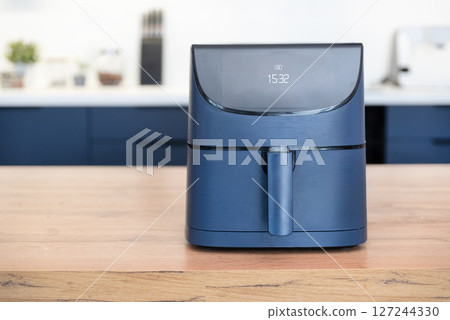 Air fryer machine in the kitchen 127244330