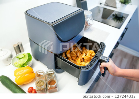 Air fryer machine in the kitchen 127244332