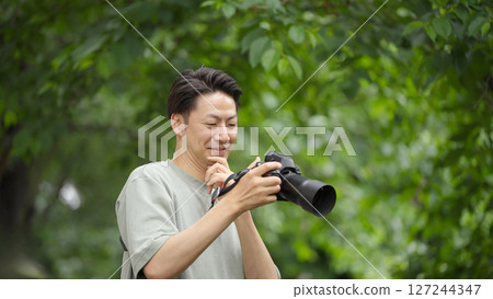 Men taking pictures 127244347