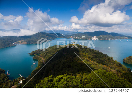 Sun Moon Lake scenery - beautiful lake view reflecting the fantastic sunrise sky. Famous tourist attraction in Nantou County, Taiwan, Asia. 127244707