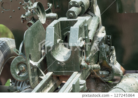 Close-up of the control mechanism of a Soviet anti-tank gun, showing construction details and aiming components 127245864