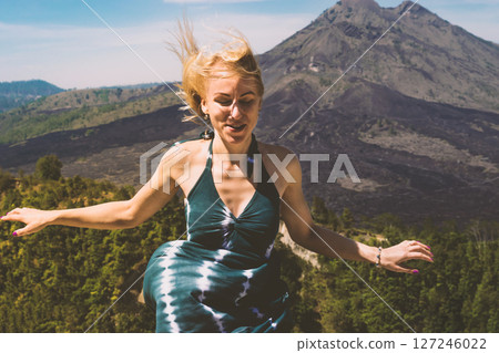Young woman in front of the Mount Batur volcano in Bali island 127246022