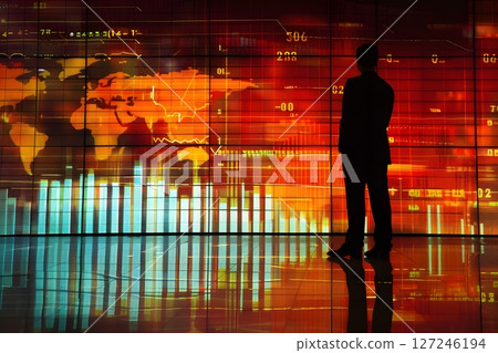 Professional man presenting financial charts on a large screen during a corporate meeting warm lighting 127246194