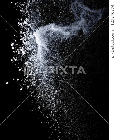 White Powder Explosion on Black Background 127246874